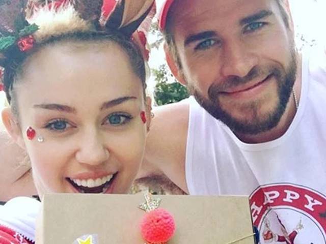 Liam Hemsworth e Miley Cyrus foto natale